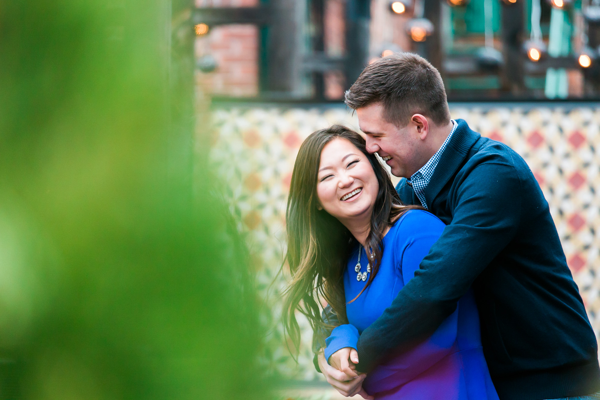 The couple who are about to get married are having a pleasant outdoor photo session.