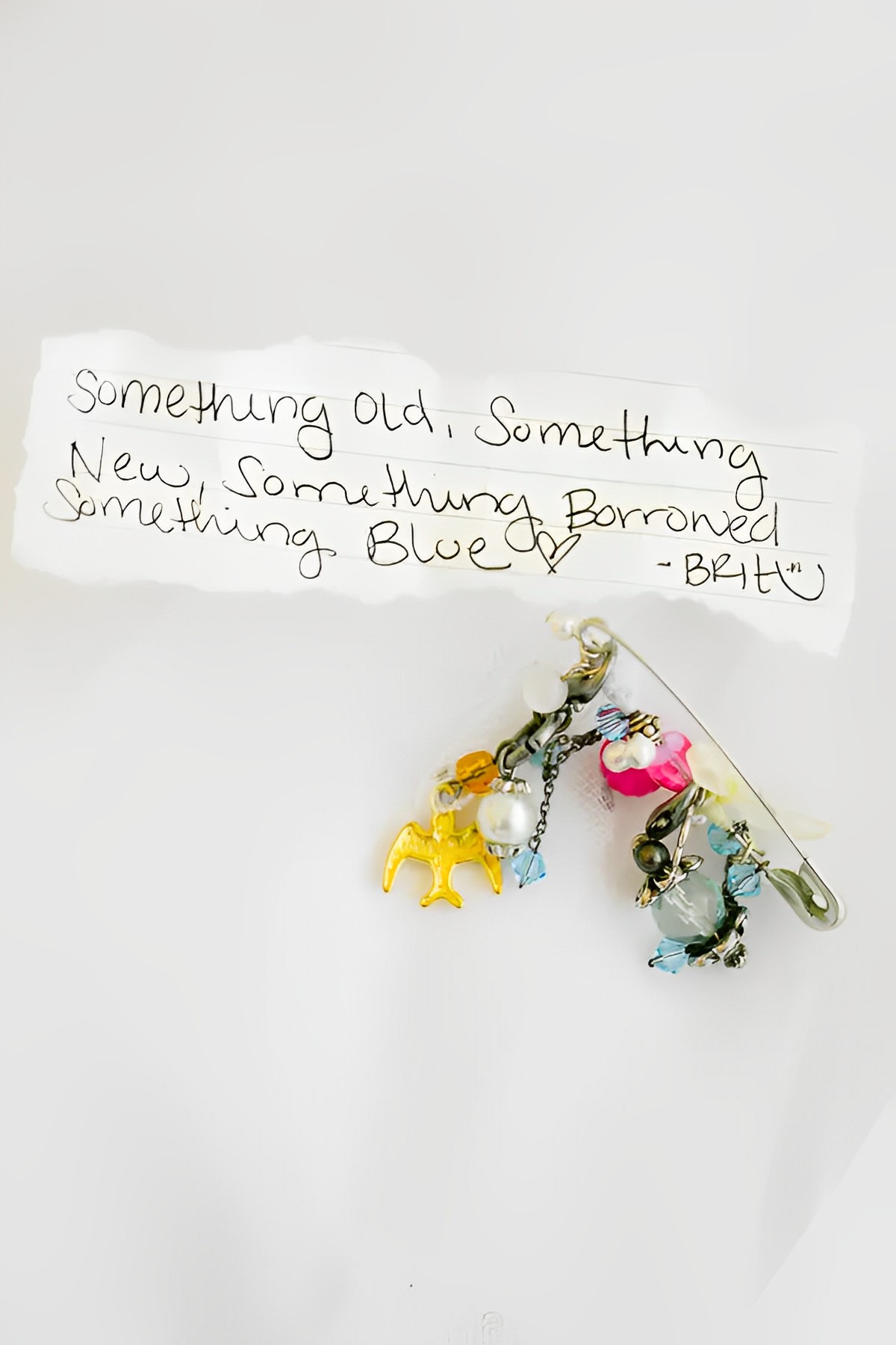 bridesmaid gave the bride a safety pin with all four things, Something Old, New, Something Borrowed, Something Blue