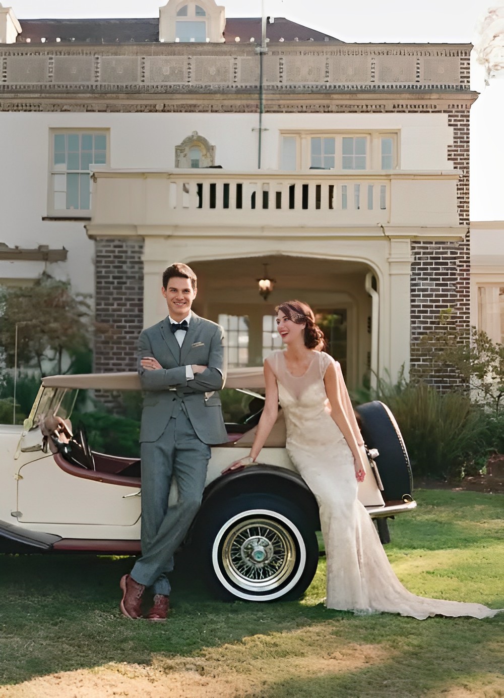 Bride and groom in traditional suit and vintage white wedding dress.