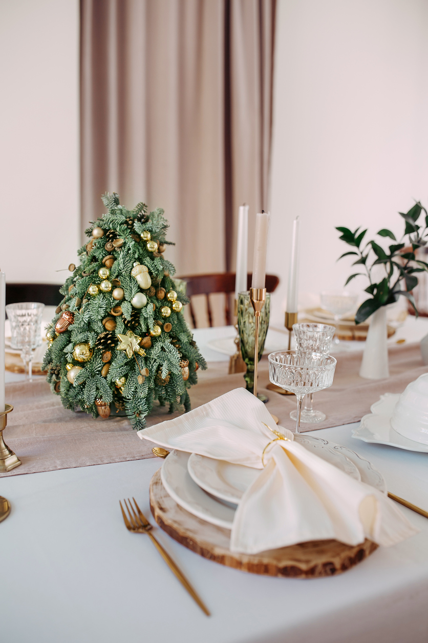 a lovely little Christmas tree as a centerpiece at a wedding reception