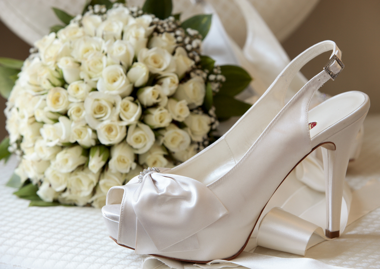 Gorgeous white open-toe wedding heels.