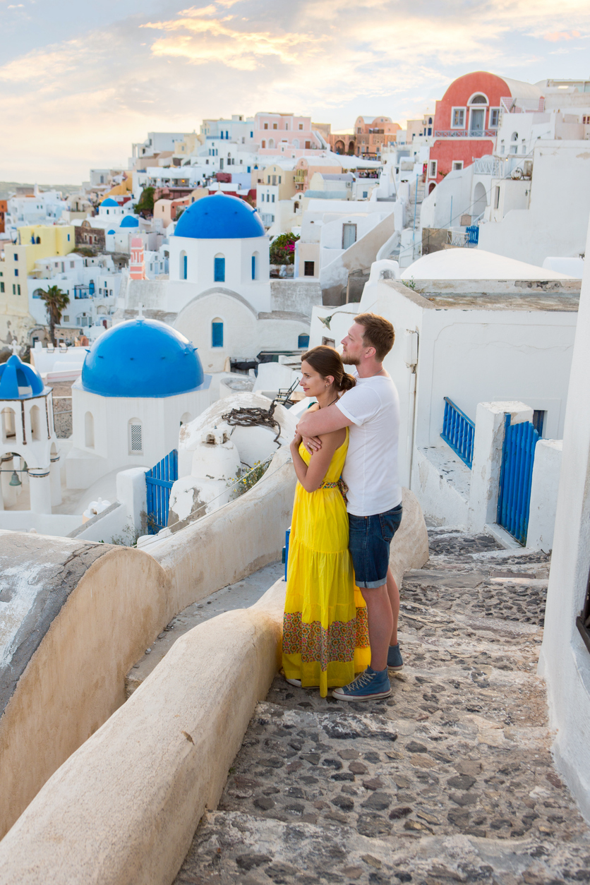 happy moments of couple honeymooners in Santorini Island, Greece