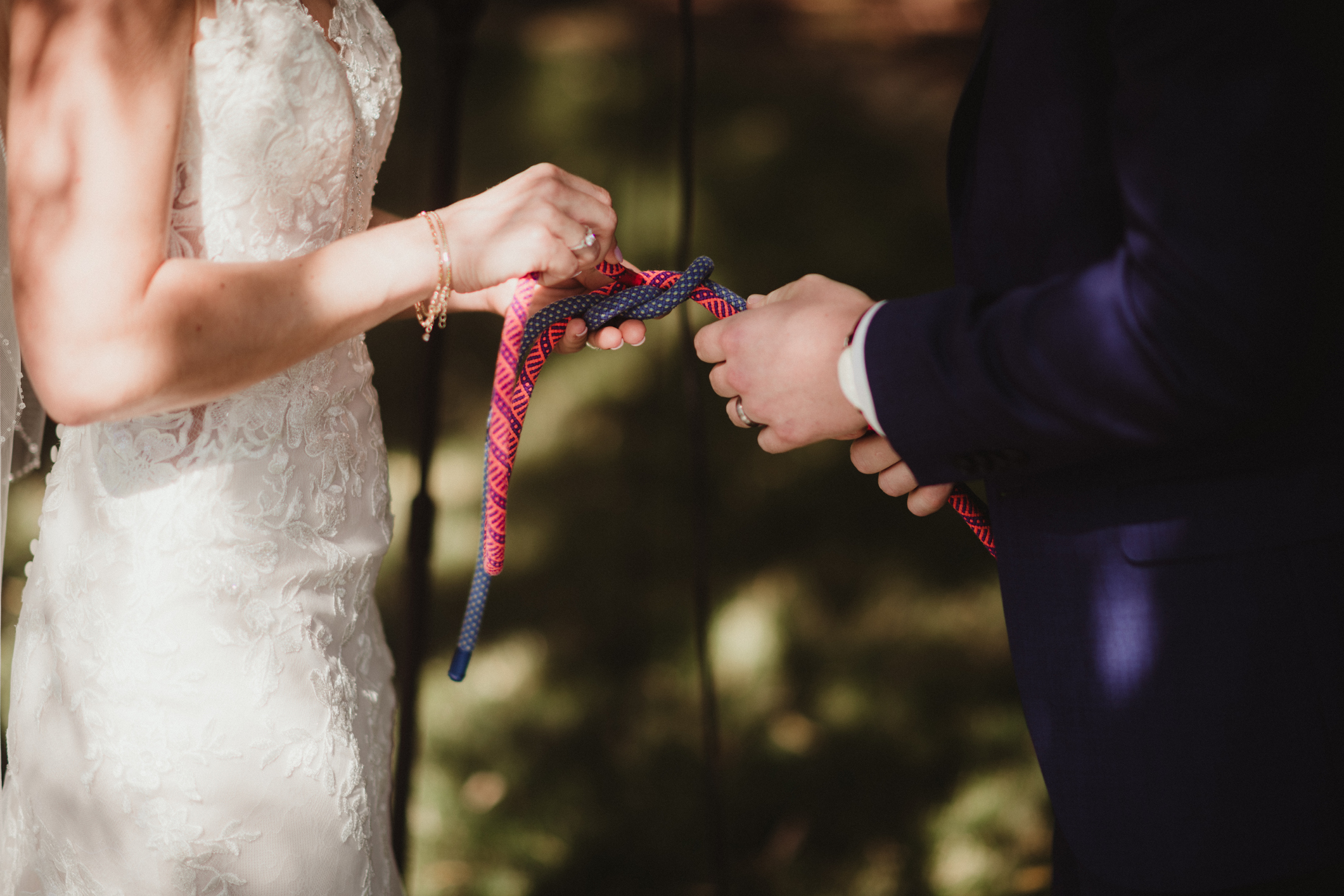 Couple tying the knot during their wedding ceremony