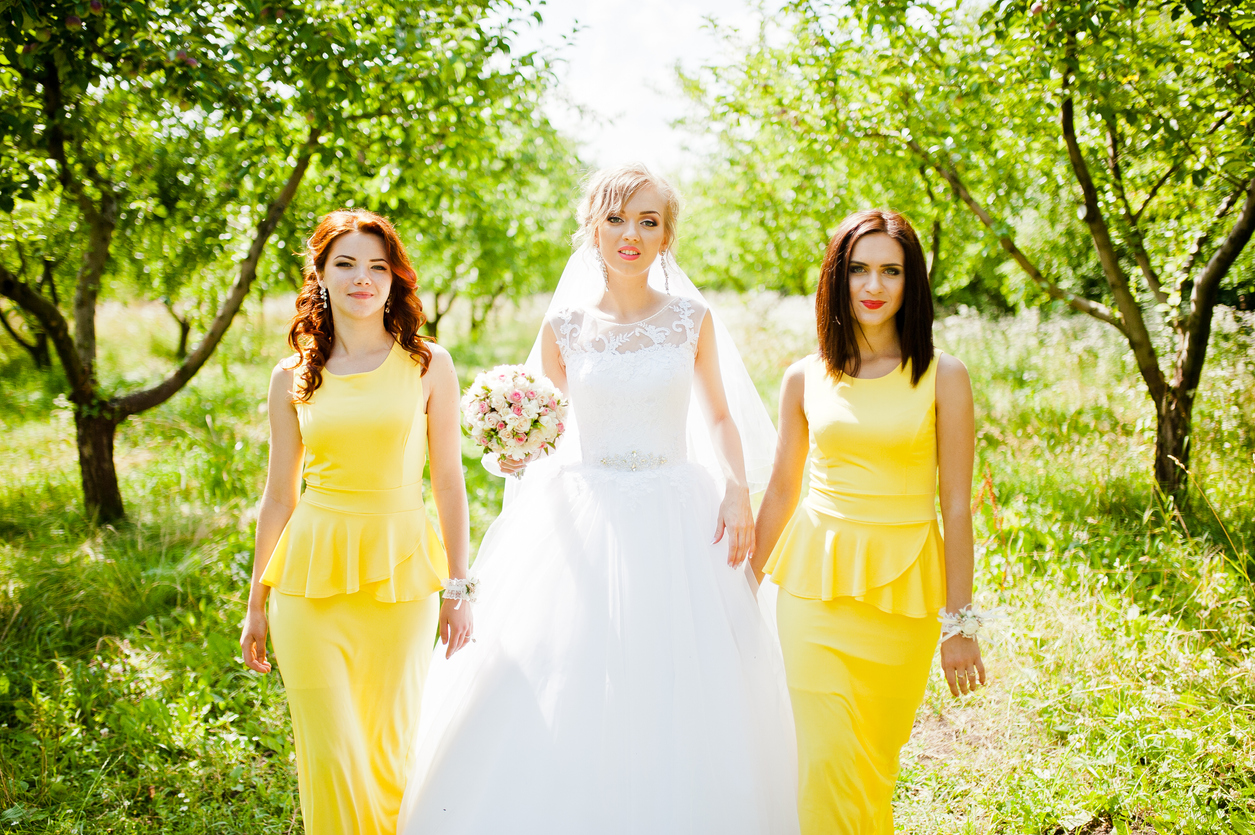 bride with bridesmaids at garden