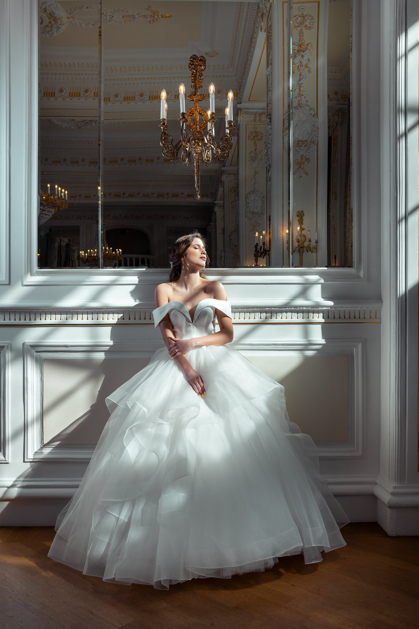 Beautiful bride with wedding makeup. Bridal fashion model posing indoors.