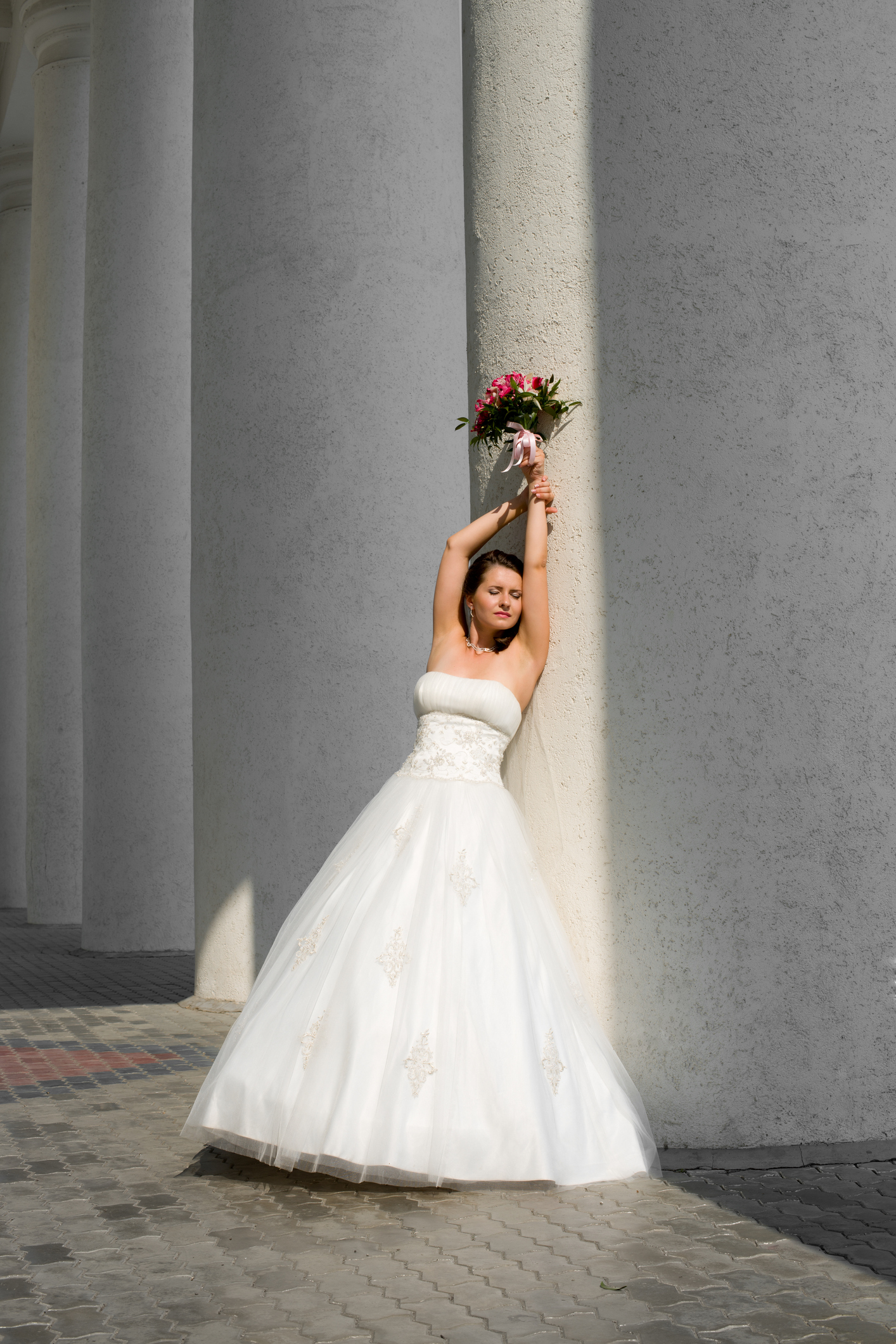 vertical photo beautiful young fiancee in white wedding dress, outdoor