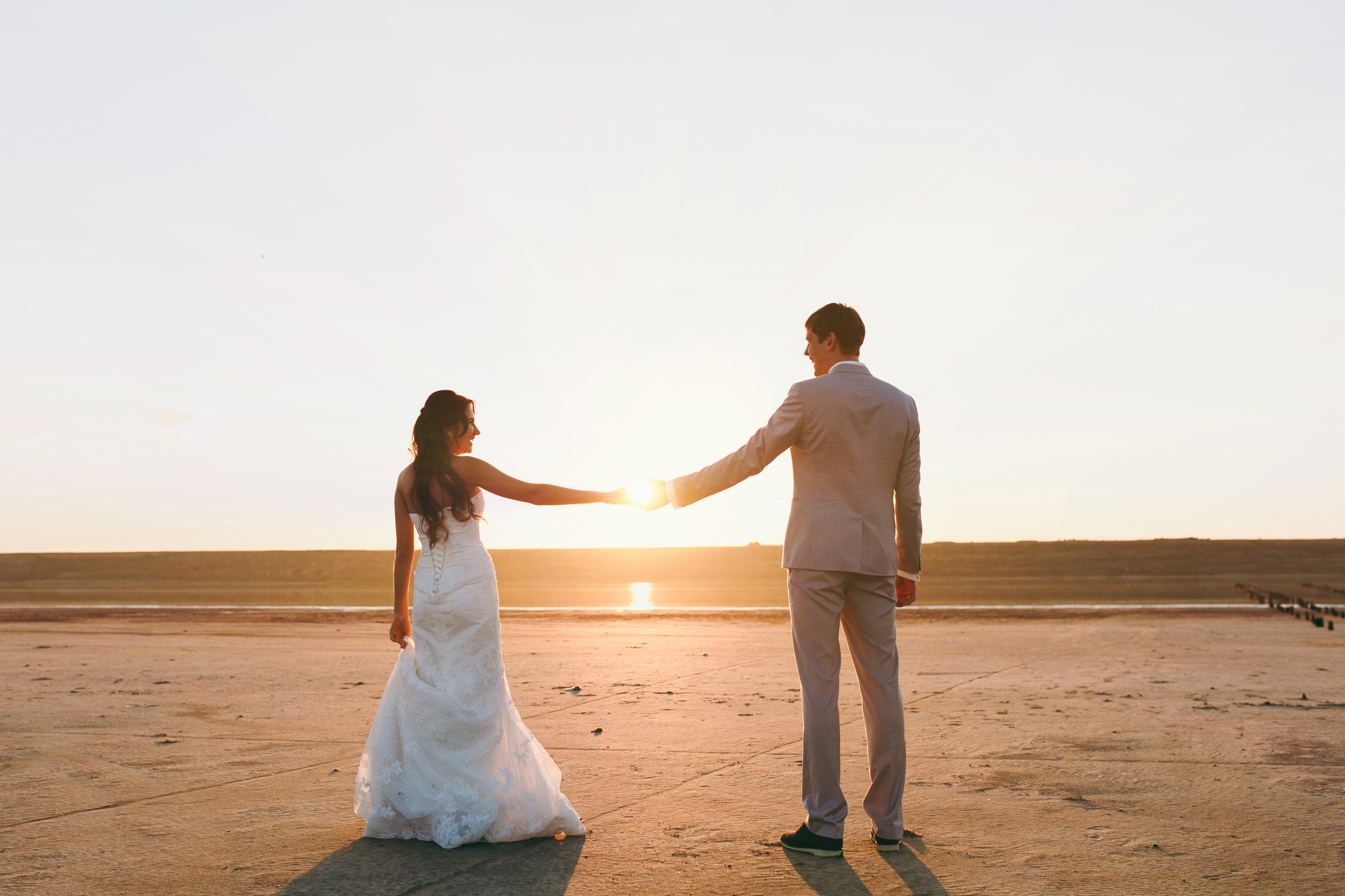 The beautiful bride and groom couple walking at the wedding