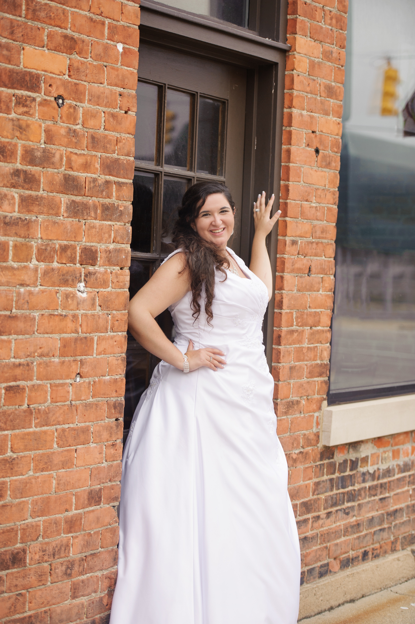 A beautiful bride posing for a photo in the city.