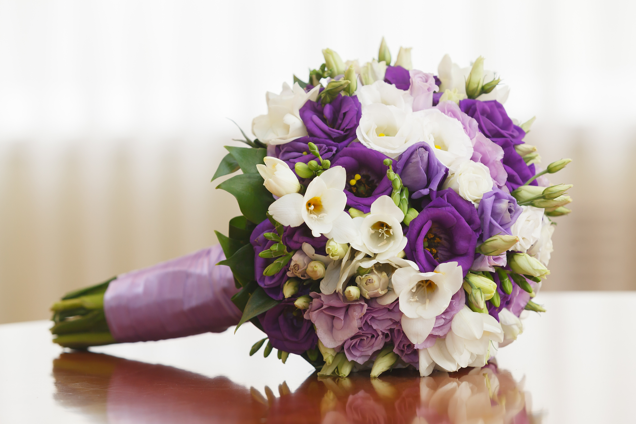 beautiful bridal bouquet with purple roses