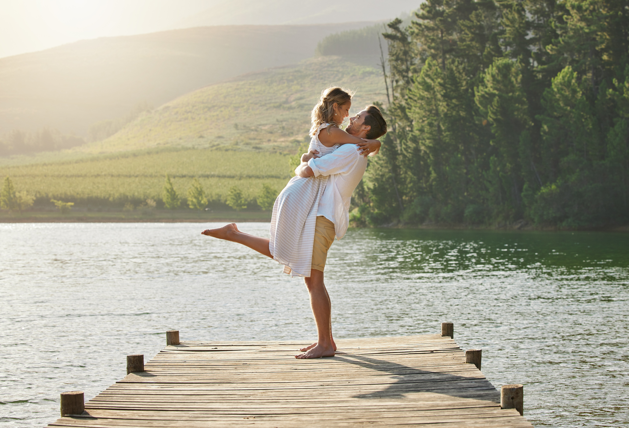 Shot of a young couple spending time together at a lake